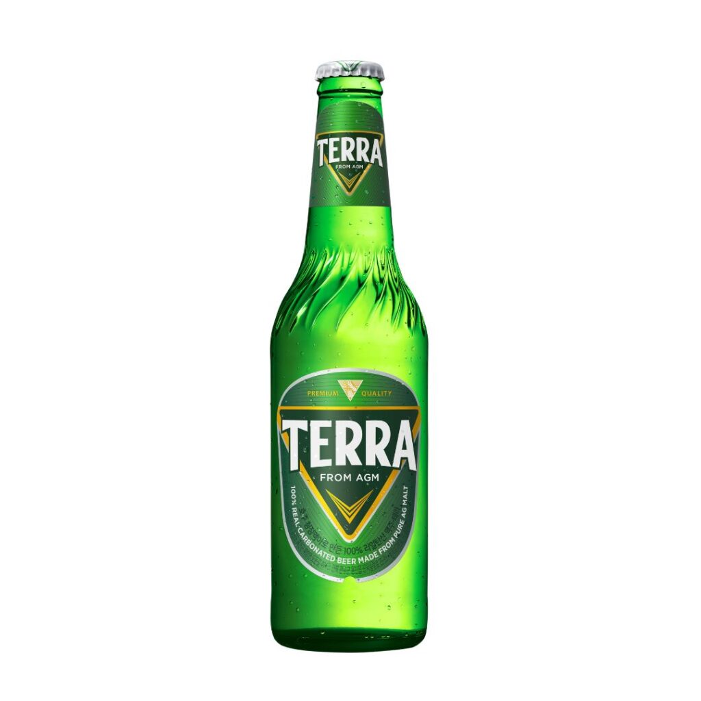 A green glass bottle of Terra beer, featuring the label "Terra from AGM" and showcasing its premium quality and 100% pure malt composition.